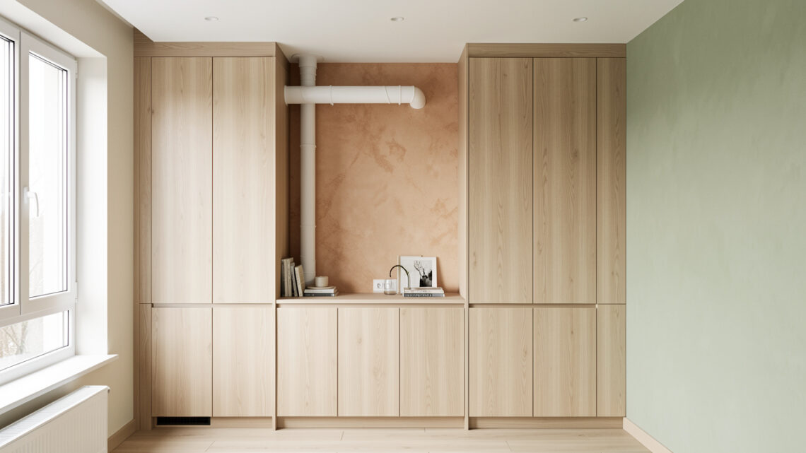 Petit appartement moderne où une goulotte de climatisation est discrètement intégrée dans un mur et dissimulée derrière un meuble encastré.